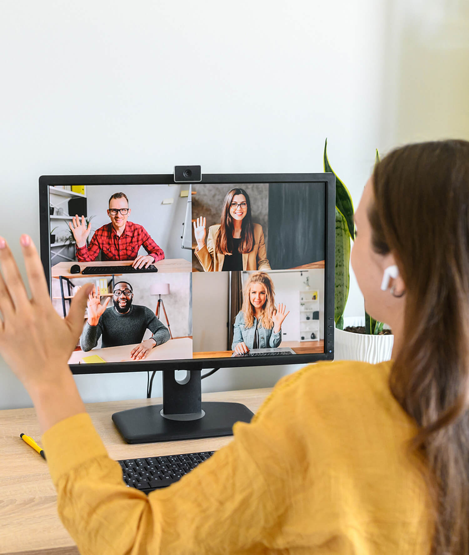 Image of a woman meeting with four people using a laptop and webcam. This image illustrates what online DBT therapy in California may look like. Reach out to an online DBT therapist in California by contacting us for online therapy. | 90274 | 90275