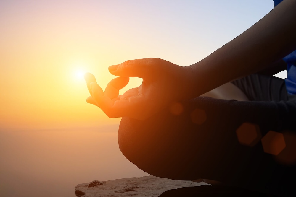 Image of a person practicing yoga while the sun rises. If you struggle with BPD symptoms, learn how borderline personality disorder therapy in Las Vegas, NV can help you begin coping in healthy ways.