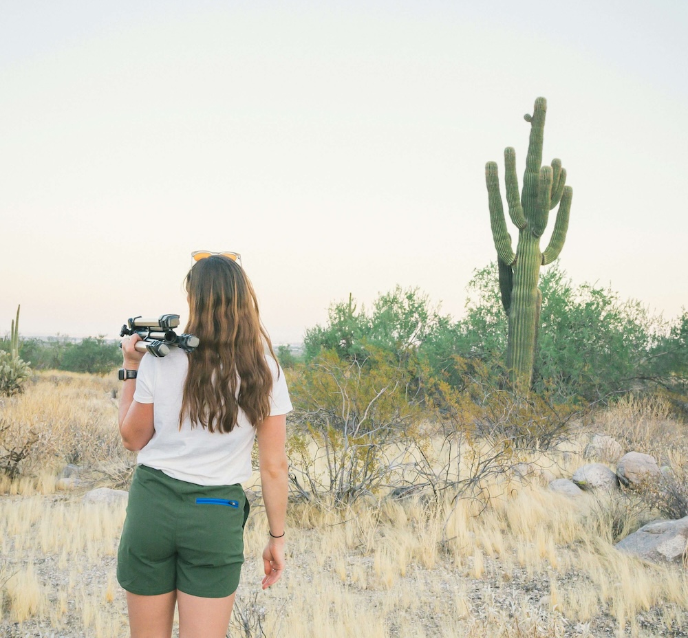 Image of a woman standing in the desert by a cactus holding a tripod on her shoulder. EMDR therapy in Las Vegas, NV can help you effectively understand your personality disorders.