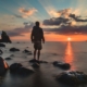 Image of a man standing on a rock and water looking at the sunrise. With EMDR therapy in Las Vegas, NV your phobias can effectively be managed in healthy ways.
