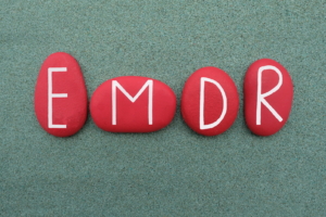 A close up of rocks with the letters emdr. Learn more about the benefits of EMDR therapy for anxiety in Las Vegas, NV and search for EMDR in las vegas, ca. Or search for an EMDR therapist in las vegas, nv.