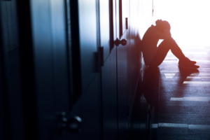 A person sits alone in a hallway. This could represent the isolation that emdr therapy in anxiety in las vegas, nv can address. Learn more about EMDR in las vegas, nv by contacting an EMDR therapist in las vegas, nv today.