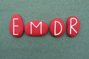 A close up of rocks with the letters emdr. Learn more about the benefits of EMDR therapy in Las Vegas, NV and search for EMDR in las vegas, ca. Or, search for an EMDR therapist in las vegas, nv.