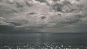 Dark clouds hover above the ocean, reflecting inner emotional storms that EMDR therapy can help process. Through EMDR therapy in Las Vegas, NV, individuals learn to face painful memories while building resilience and inner calm.