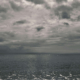 Dark clouds hover above the ocean, reflecting inner emotional storms that EMDR therapy can help process. Through EMDR therapy in Las Vegas, NV, individuals learn to face painful memories while building resilience and inner calm.