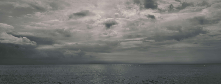Dark clouds hover above the ocean, reflecting inner emotional storms that EMDR therapy can help process. Through EMDR therapy in Las Vegas, NV, individuals learn to face painful memories while building resilience and inner calm.