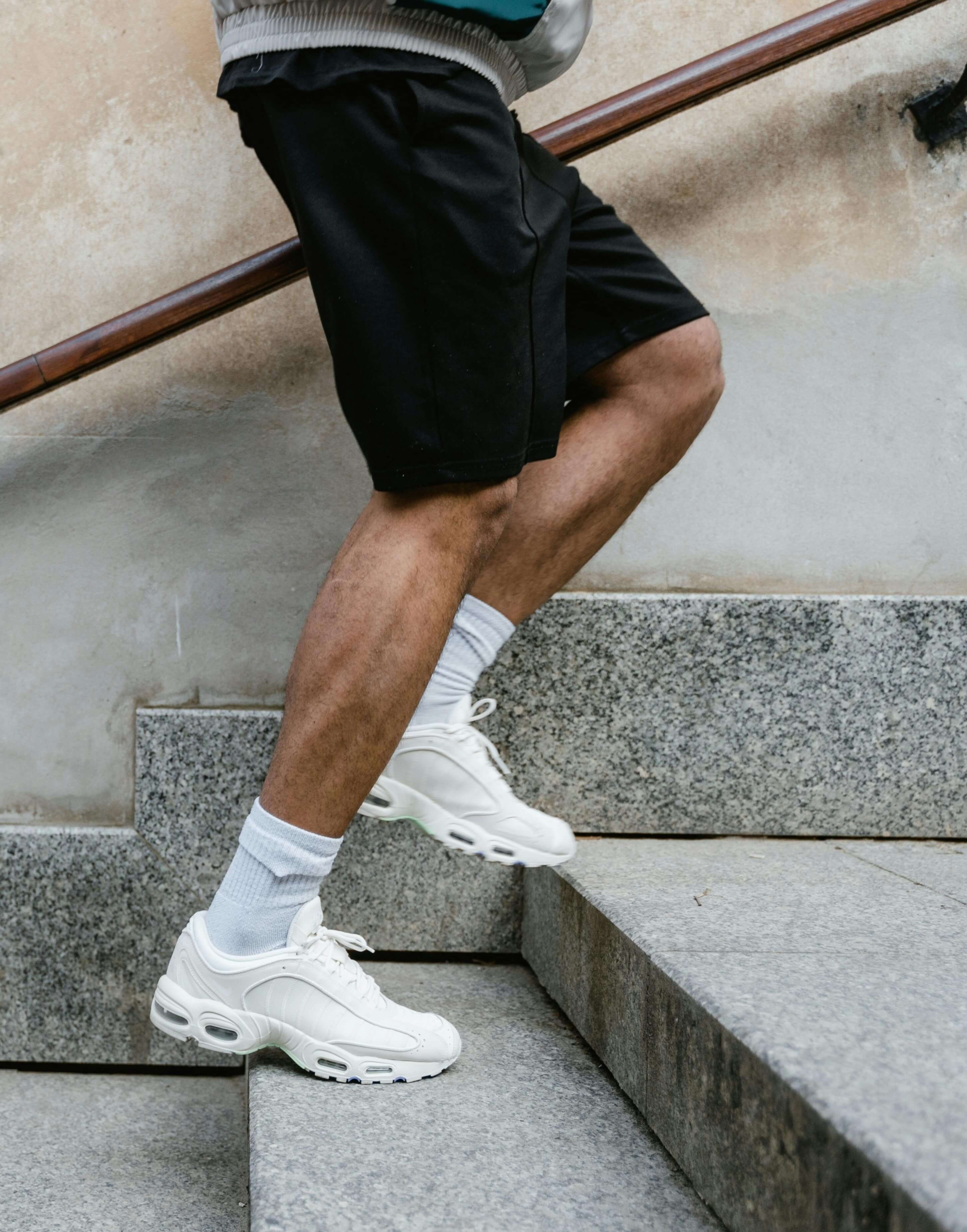 A man walks up stairs in athletic shoes. Regular movement and exercise are vital DBT skills for emotional regulation. Joining a DBT group or working with a DBT therapist in Las Vegas helps build healthy routines for mind-body wellness.