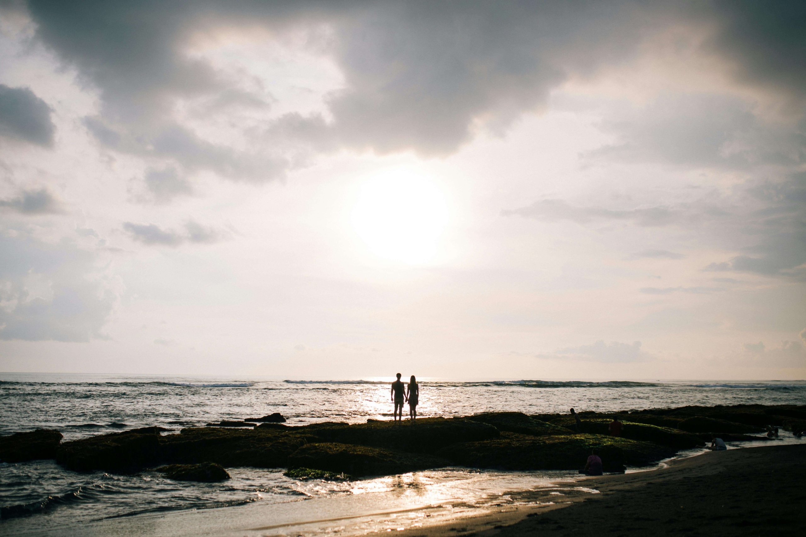 A couple stands together at the shoreline during sunset. DBT therapy and EMDR therapy help rebuild connection, calm emotional storms, and restore trust. A DBT therapist in Las Vegas, NV, can guide this journey toward mindful, compassionate healing.