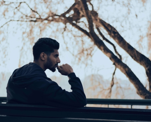 A man sits alone on a park bench, thinking quietly. If you feel like you’re struggling, therapy for men can help you feel more confident and grounded. Online DBT therapy in Torrance, CA, helps men build strength and steadier ways to cope.