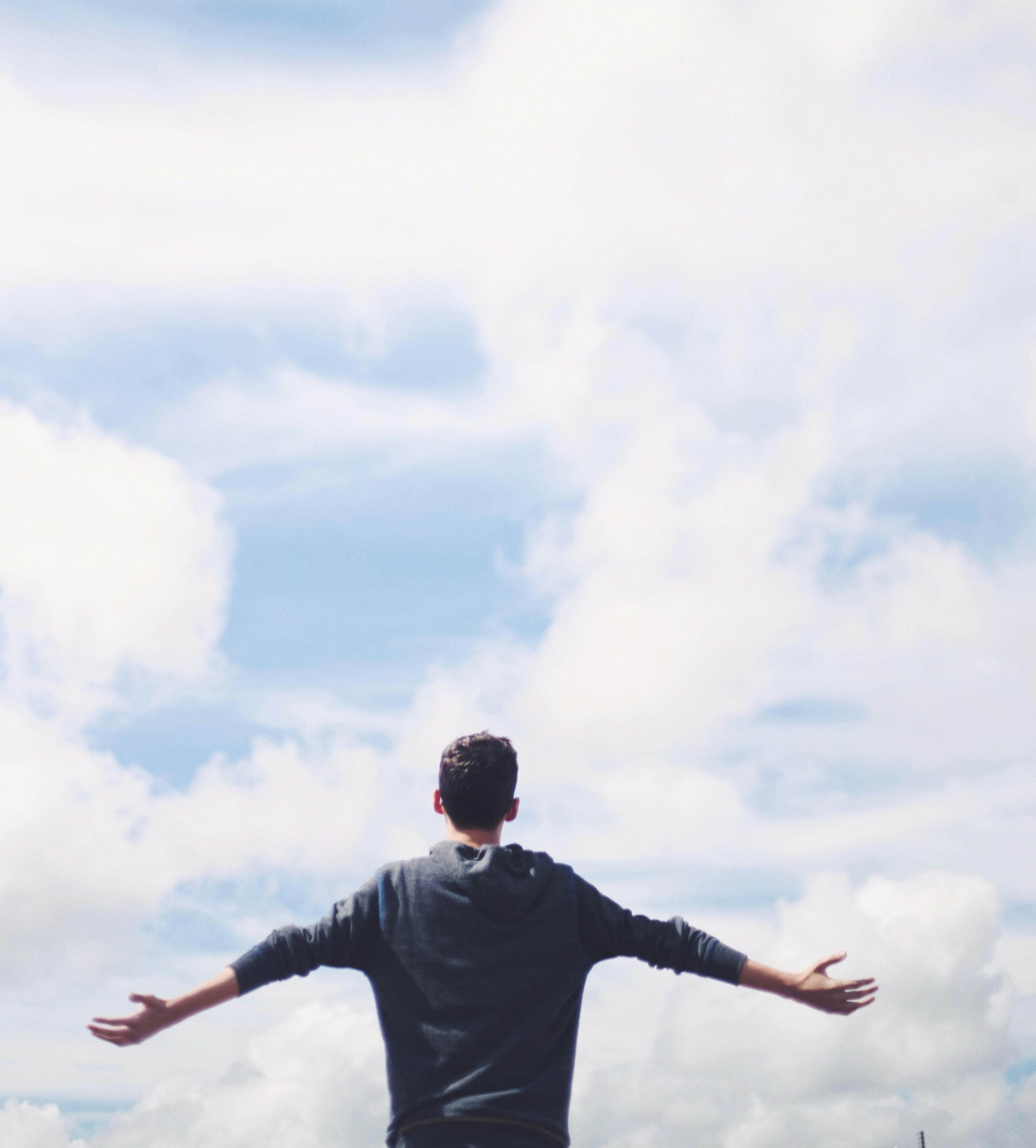 A man stands outdoors with arms spread wide, symbolizing release and the emotional freedom Men’s therapy can support. Are you asking if DBT skills in Las Vegas, NV, might help you loosen anger’s hold? Practical strategies can turn overwhelming intensity into steadier resilience.