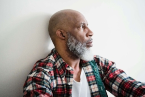 An older man gazes to the side with tension in his expression, reflecting inner conflict addressed through Therapy for men. Are you considering whether a DBT therapist in Torrance, CA, could help you reconnect with calmer choices? Tools for grounding can shift anger into insight.