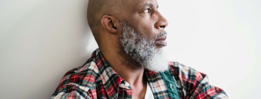 An older man gazes to the side with tension in his expression, reflecting inner conflict addressed through Therapy for men. Are you considering whether a DBT therapist in Torrance, CA, could help you reconnect with calmer choices? Tools for grounding can shift anger into insight.