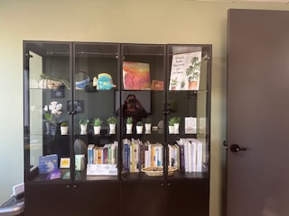 A bookshelf inside Integrative Path Therapy’s Torrance office. Want to learn more about DBT therapy in Torrance, CA? Reach out today and discover how you may benefit from this therapeutic approach to healing.
