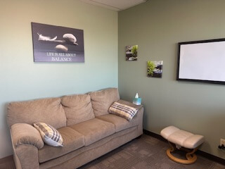 A sofa inside the Integrative Path Therapy Torrance office. Want to learn dbt skills in Torrance, CA? Discover the convenience of online sessions that can help you develop skills for overcoming trauma, anxiety, and more.
